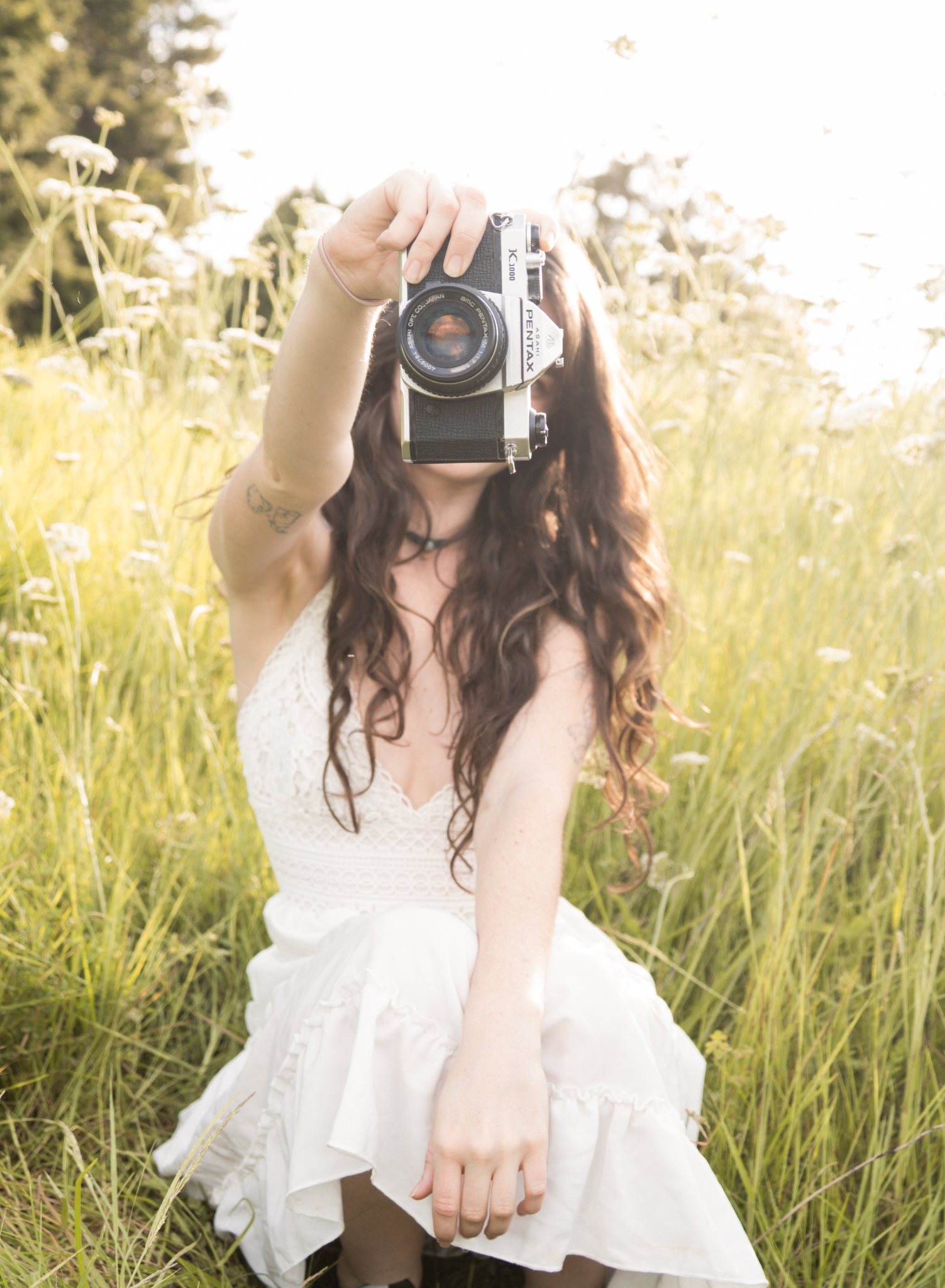 Sam holding a camera